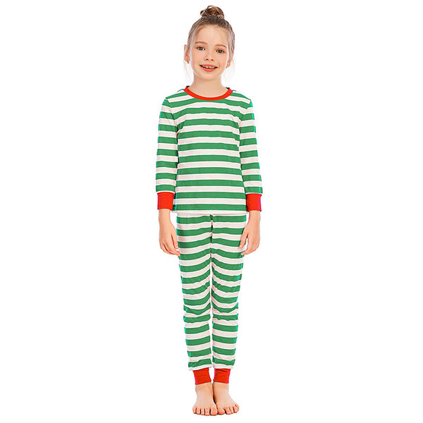 Girl wearing red and white striped long-sleeved pajamas with green trim on collar and cuffs. - Image 3
