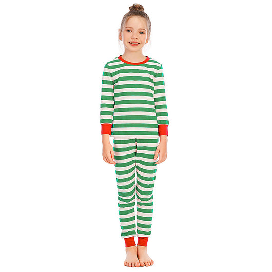 Girl wearing red and white striped long-sleeved pajamas with green trim on collar and cuffs. - Image 3