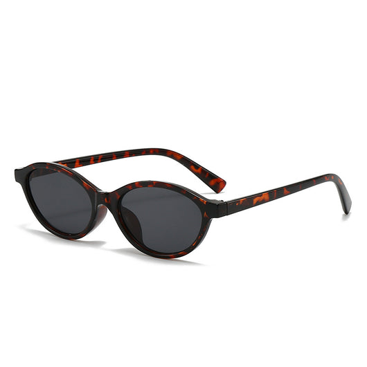 Retro fashion small frame sunglasses with translucent brown frames and yellow oval lenses, viewed from an angle. - Image 9