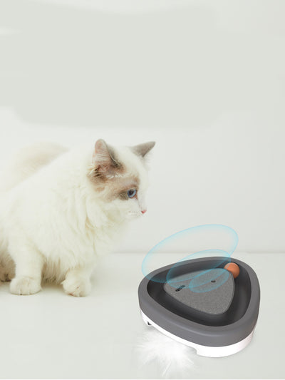 Two-tone green and grey triangle electric cat toy with a rotating feather wand and a ball track on a tiled floor. - Image 5