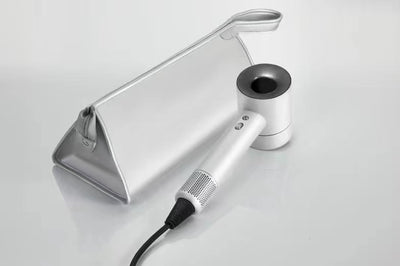 Modern matte blue handheld hair dryer with gold nozzle accent and perforated air intake, featuring control buttons. - Image 3