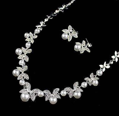 Silver-tone necklace and stud earrings set with butterfly-like motifs, clear rhinestones, and white faux pearls. - Image 3