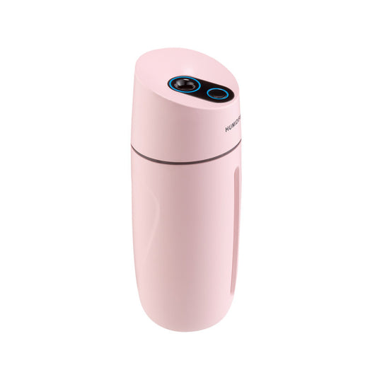 White desktop humidifier with blue LED light strip and control buttons, emitting mist on a wooden surface. - Image 8