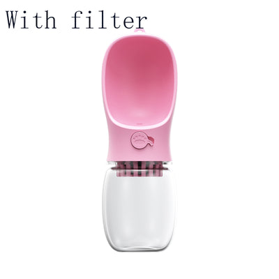 White portable pet water bottle with a clear reservoir and built-in drinking bowl, shown in a bag. - Image 13