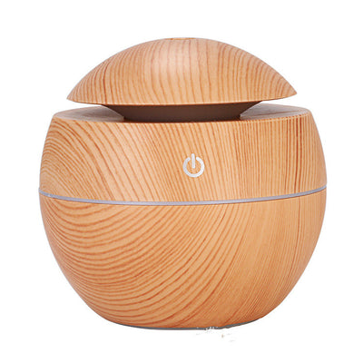 Dark wood grain aroma diffuser and humidifier with a silver power button and accent line.