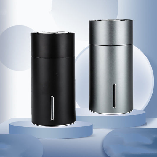 Black cylindrical vehicular humidifier with a silver trim and a vertical indicator light on a white background. - Image 12