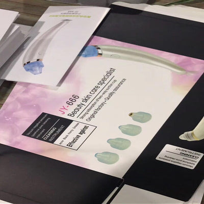 Rose gold and white electric blackhead suction instruments with clear heads, displayed next to their product box. - Image 5