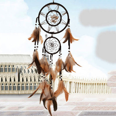 Bohemian dreamcatcher wind chime with black hoops, brown and tan feathers, and black and white beads. - Image 2