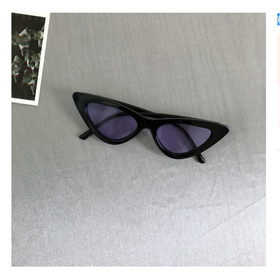 Retro cat-eye sunglasses with a tortoiseshell frame and dark lenses, ideal for a stylish, vintage look. - Image 19