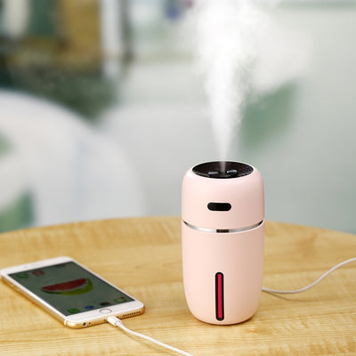 Black portable humidifier with a silver band, a power button, and a water level indicator, suitable for car or home. - Image 6
