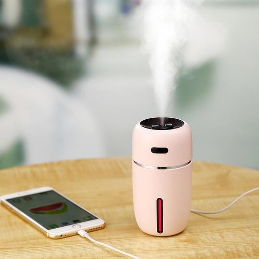 Black portable humidifier with a silver band, a power button, and a water level indicator, suitable for car or home. - Image 6