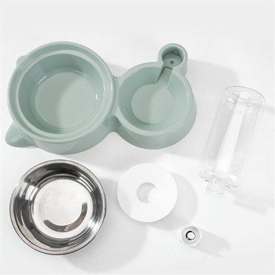White pet feeding station with a stainless steel food bowl and a clear automatic water dispenser bottle. - Image 4