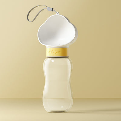 Yellow and clear portable pet water bottle with integrated drinking bowl and separate food container for walking dogs. - Image 4