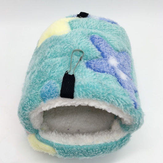 Colorful plush pet sleeping bag with purple, blue, and pink blocks, white fleece lining, and metal hooks for hanging. - Image 3