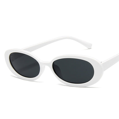 Small frame oval sunglasses with a tortoiseshell pattern and brown lenses on a white background. - Image 9