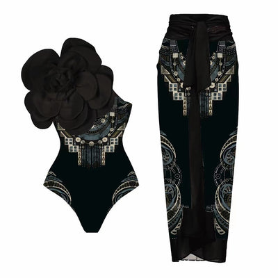 Women's one-piece swimsuit with a black, gold chain, and anchor pattern, featuring a large teal flower on one shoulder. - Image 5