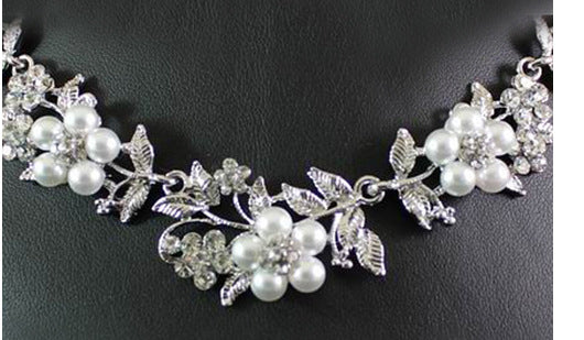 Silver-tone bridal necklace and earring set with white pearls and clear rhinestones in a floral leaf design. - Image 4