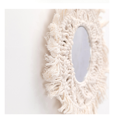 Circular mirror with a beige macrame fringe border, featuring intricate knotwork around the reflective surface. - Image 11