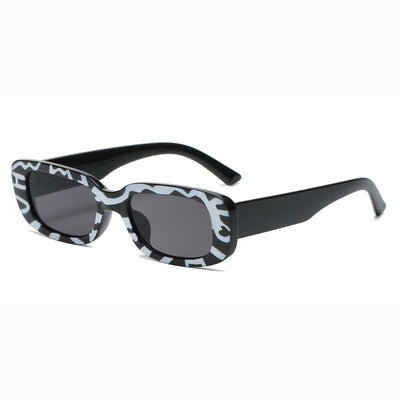 Rectangular tortoiseshell sunglasses with a small frame and dark gray lenses, angled on a white background. - Image 20
