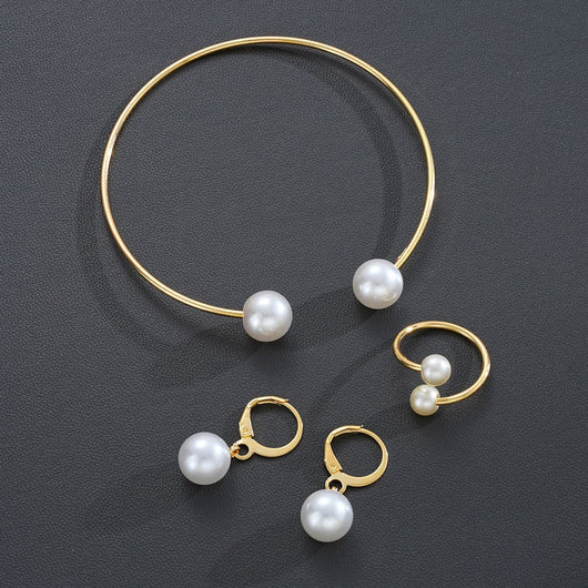 Gold-tone open cuff bracelet, matching open ring, and dangle earrings, all featuring white faux pearls. - Image 4
