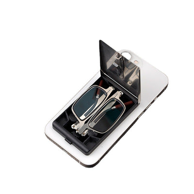 Foldable blue light blocking glasses with silver frames in a black case, shown on a smartphone. - Image 5