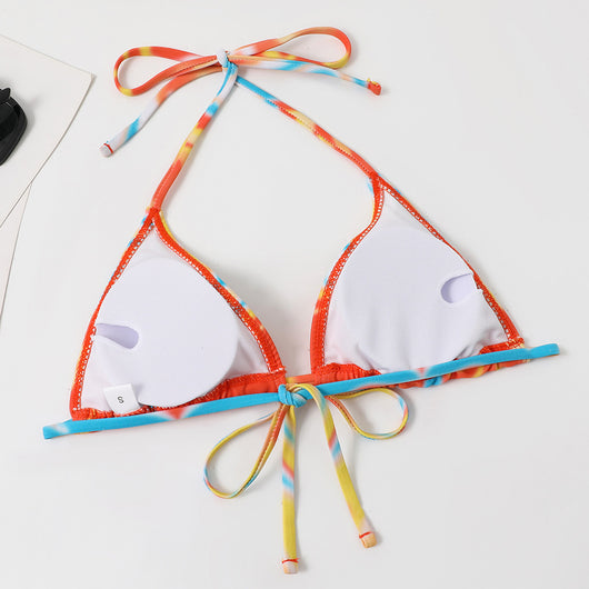 Four-piece tie-dyed bikini swimsuit set in orange, yellow, and white, with a triangle top, high-cut bottoms, ruched mini skirt, and matching headscarf. - Image 45