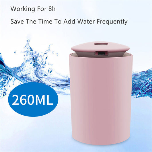 White cylindrical USB mini humidifier with blue LED light, emitting a fine mist, suitable for home or car. - Image 3