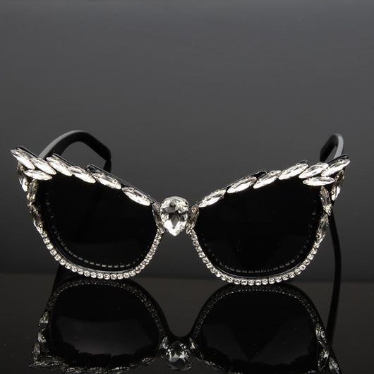 Black cat-eye sunglasses with clear rhinestones along the frames and a large teardrop rhinestone at the bridge. - Image 2