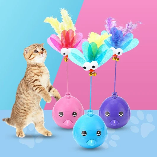 Purple electric tumbler cat toy with a blue bird-like top, pink feathers, googly eyes, and small bells.