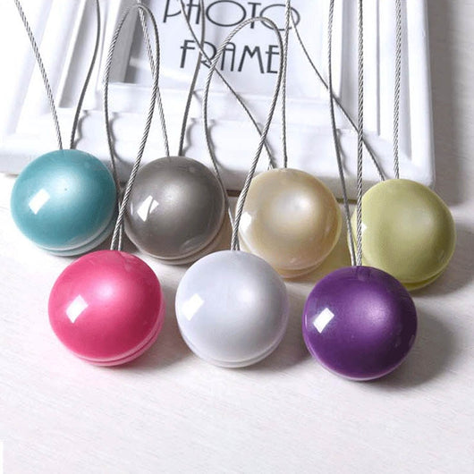 Purple magnetic curtain tieback with a round buckle and a thin silver wire loop on a white background. - Image 3