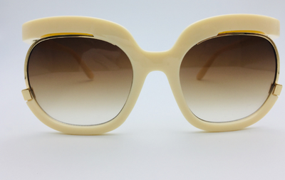 Black cat-eye half-frame sunglasses with gold accents and purple-grey gradient lenses, shown from front and side. - Image 18