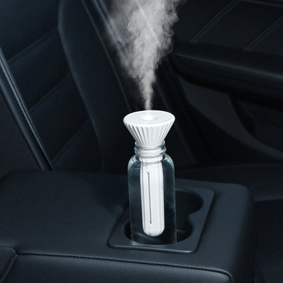 Beige and white USB ultrasonic humidifier with a fluted conical top and a cylindrical body with a water level window. - Image 2