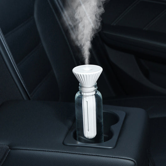 Beige and white USB ultrasonic humidifier with a fluted conical top and a cylindrical body with a water level window. - Image 2