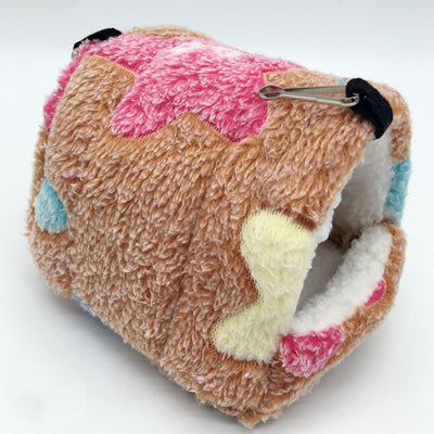 Colorful plush pet sleeping bag with purple, blue, and pink blocks, white fleece lining, and metal hooks for hanging. - Image 2