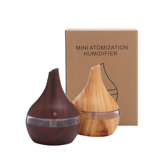 Teardrop-shaped humidifier with light wood grain finish and clear water tank, featuring a power button icon. - Image 7