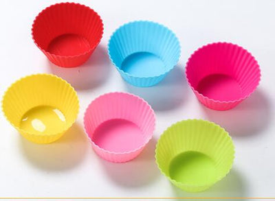 Six colorful silicone cupcake liners in red, blue, hot pink, yellow, pink, and lime green on a white background. - Image 8