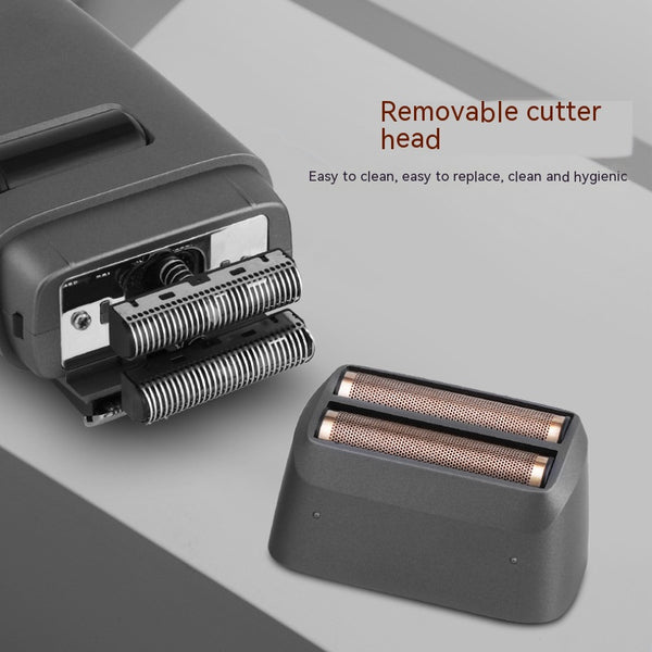 Silver electric shaver with a rose gold power button and LCD display showing '99', next to a replacement shaver head.