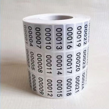 Roll of matte silver adhesive labels with sequential black serial numbers from 00001 to 00024 visible. - Image 5