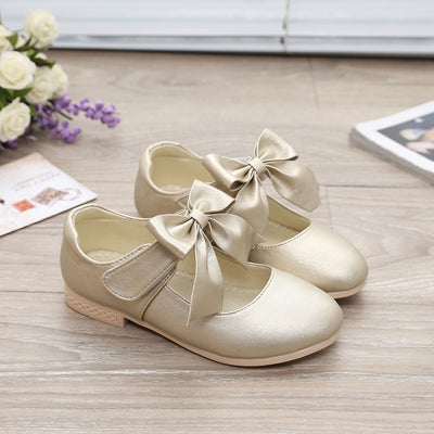 Gold Mary Jane shoes for girls with a large decorative bow on the strap and a low, comfortable heel. - Image 14