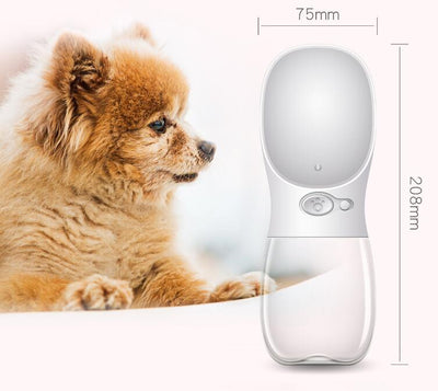 White portable pet water bottle with a clear reservoir and built-in drinking bowl, shown in a bag. - Image 5