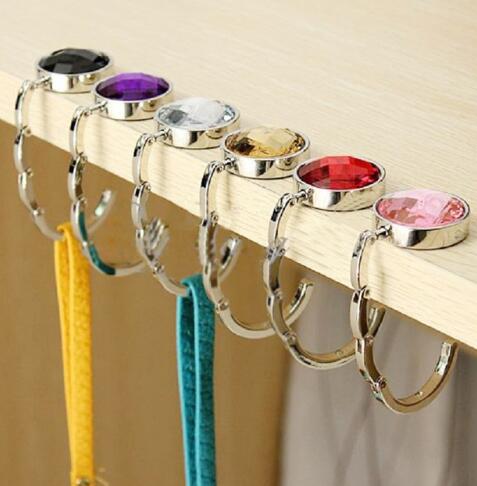 Gancho Plegable de Metal para Bolsas - Soporte Portátil para Carteras y Handbags