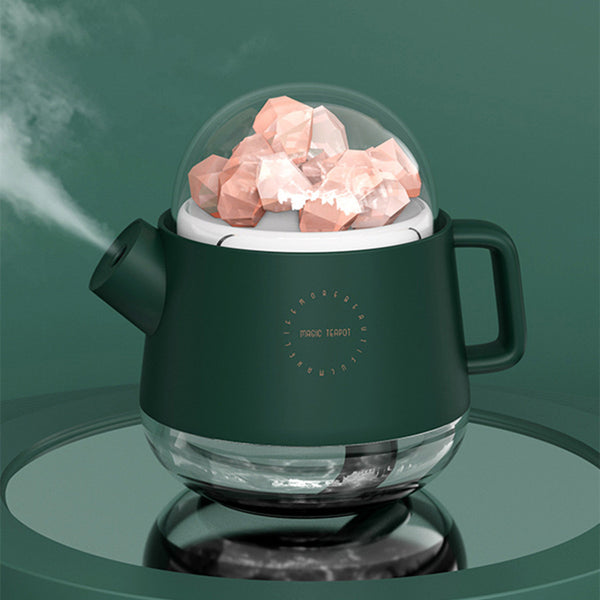 Pink kettle-shaped mini USB humidifier with a clear dome top filled with pink salt crystals, emitting mist. - Image 9
