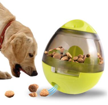 Pink and clear egg-shaped pet food dispenser with internal baffles, designed for slow feeding.