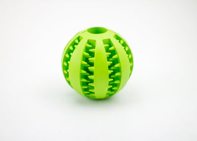 Bright green rubber pet toy ball with textured spikes and ridges for dental cleaning and food dispensing. - Image 10