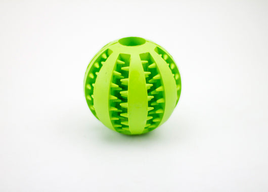 Bright green rubber pet toy ball with textured spikes and ridges for dental cleaning and food dispensing. - Image 10