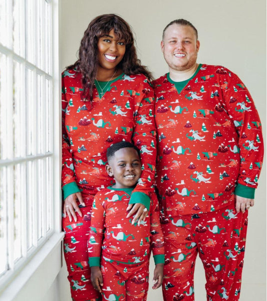 Red long-sleeved men's pajama set with a festive dinosaur and Christmas tree print, featuring green cuffs.