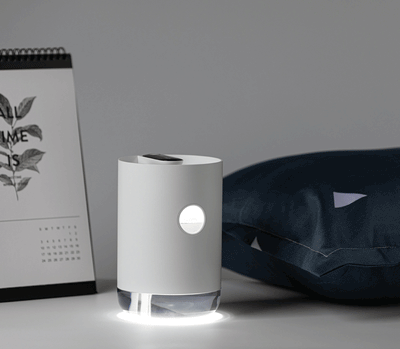 White cylindrical humidifier with a transparent base, digital display, and 1000ml capacity indicator. - Image 3