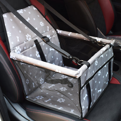 Light grey pet car booster seat with black mesh sides and adjustable straps, installed on a black and red car seat. - Image 13