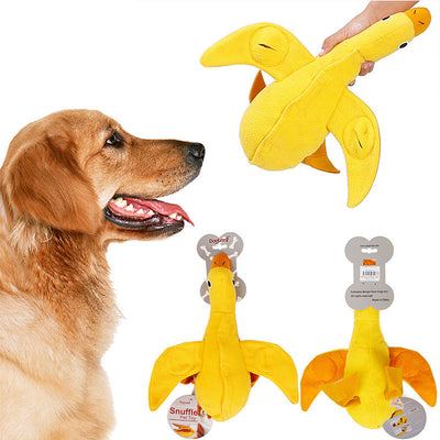Golden retriever puppy biting a yellow plush duck dog toy with an orange beak and black eyes. - Image 4
