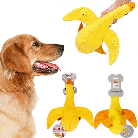 Golden retriever puppy biting a yellow plush duck dog toy with an orange beak and black eyes. - Image 4